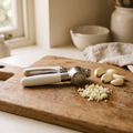 Luniee Garlic Press on a cutting board