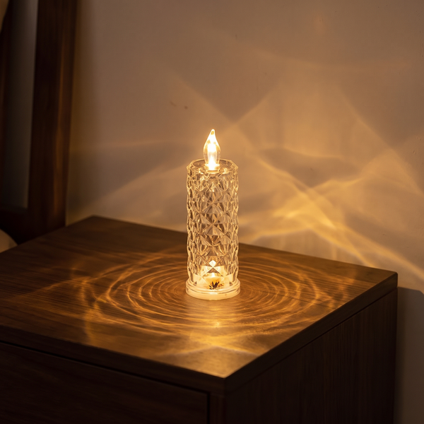 Luniee Crystal Glow Candle in warm yellow, refracted light pattern on a side table
