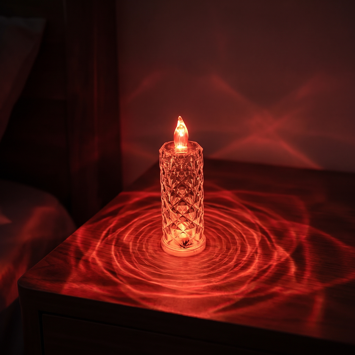 Luniee Crystal Glow Candle in red, refracted red light on the table and wall
